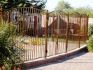 A close up of the arched pool fencing