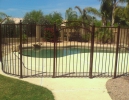 pool safety fencing with an arched gate