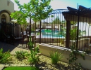 3-rail arched decorative pool fencing on top of masonry
